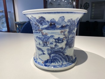 A fine Chinese blue, white and copper red 'Master of the Rocks' brush pot, Kangxi